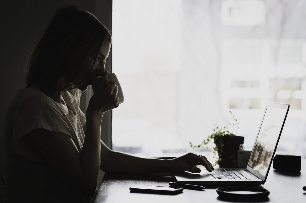 Woman watching computer screen